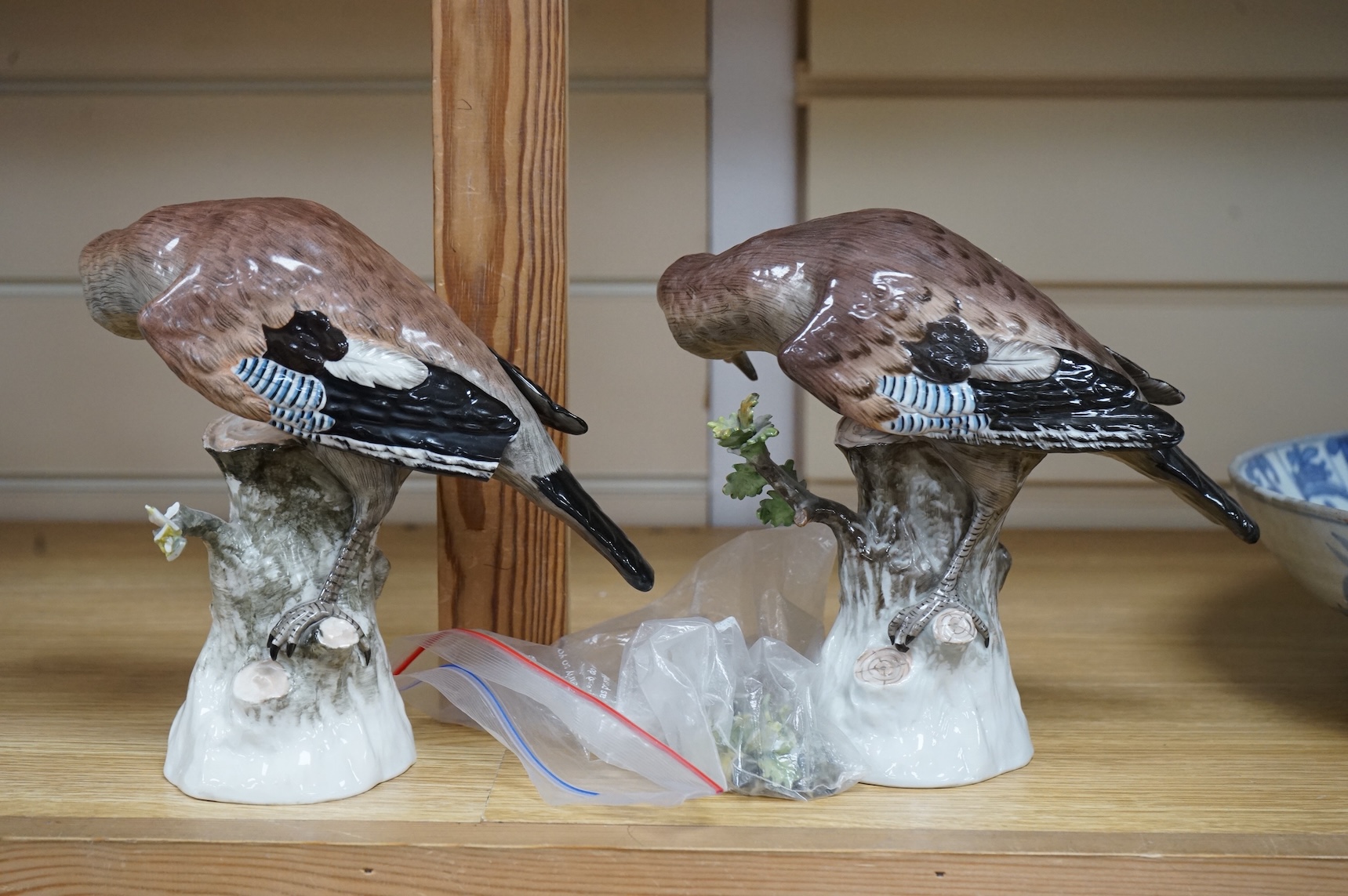 A pair of Meissen style porcelain models of Jays, 18cm
